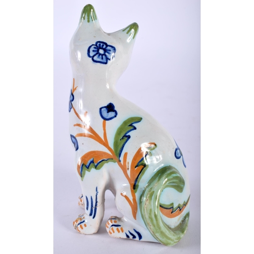 495 - A SMALL MASONIC FAIENCE TIN GLAZED POTTERY FIGURE OF A CAT. 10 cm x 5 cm.