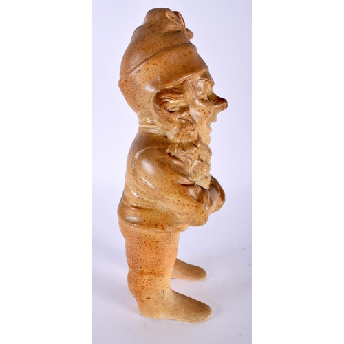 505 - A VERY UNUSUAL 19TH CENTURY ENGLISH STONEWARE FIGURE OF A GNOME modelled smiling with hands clasped.... 