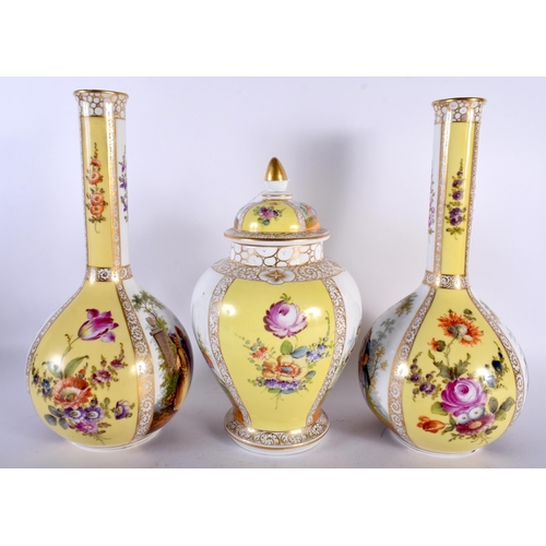 515 - A 19TH CENTURY GERMAN DRESDEN PORCELAIN GARNITURE OF VASES painted with figures upon a yellow ground... 