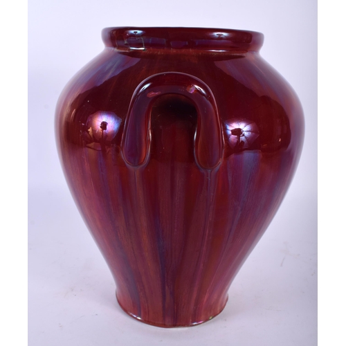 515A - AN ART NOUVEAU HIGH FIRED RUSKIN STYPE LUSTRE VASE. 25 cm x 16 cm.