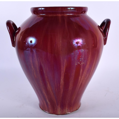 515A - AN ART NOUVEAU HIGH FIRED RUSKIN STYPE LUSTRE VASE. 25 cm x 16 cm.