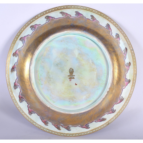 515C - A LARGE WEDGWOOD LUSTRE PORCELAIN DRAGON DISH painted with landscapes. 27 cm diameter.