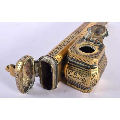 516A - A 19TH CENTURY MIDDLE EASTERN ISLAMIC BRASS PEN BOX with attached inkwell. 18 cm wide.