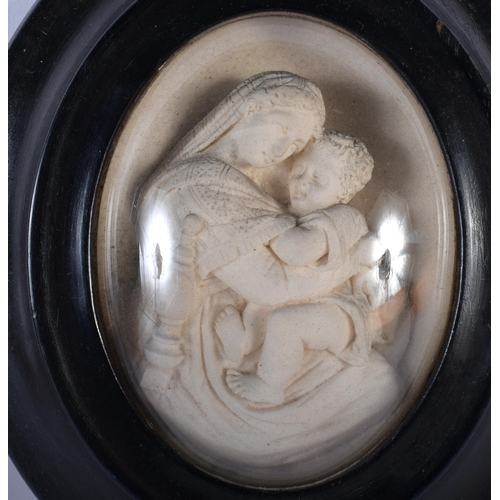 516C - A 19TH CENTURY ITALIAN CARVED MADONNA AND CHILD ICON together with an Italian plaster figure. Larges... 