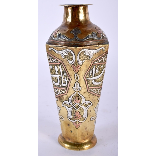 517 - A 19TH CENTURY MIDDLE EASTERN SILVER INLAID BRONZE VASE decorative with Kufic scripture. 14 cm high.