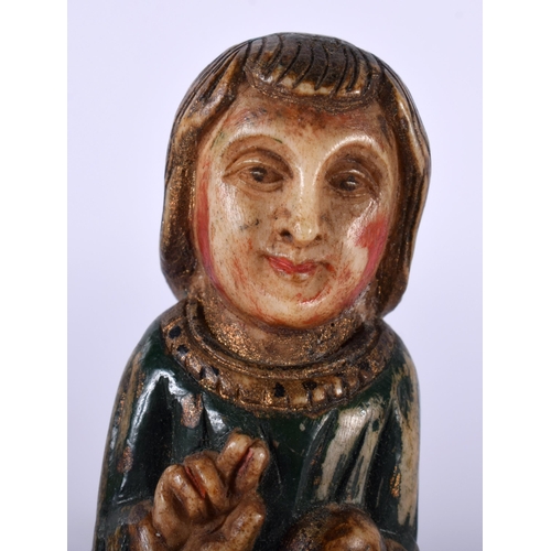 517E - AN 18TH/19TH CENTURY INDO PORTUGUESE GOA POLYCHROMED FIGURE OF A SAINT modelled upon a wooden base. ... 