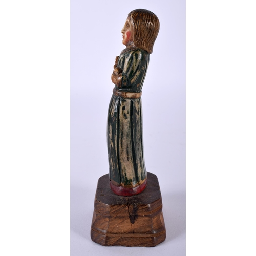 517E - AN 18TH/19TH CENTURY INDO PORTUGUESE GOA POLYCHROMED FIGURE OF A SAINT modelled upon a wooden base. ... 