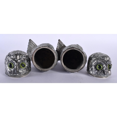 518D - A PAIR OF ANTIQUE SILVER PLATED GLASS EYED OWL CONDIMENTS. 686 grams. 11.75 cm x 7 cm.