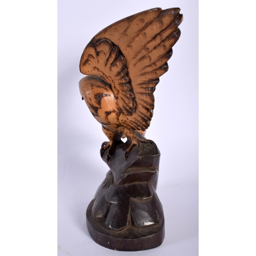 519 - AN ANTIQUE BAVARIAN BLACK FOREST CARVED WOOD HAWK. 21 cm x 13 cm.