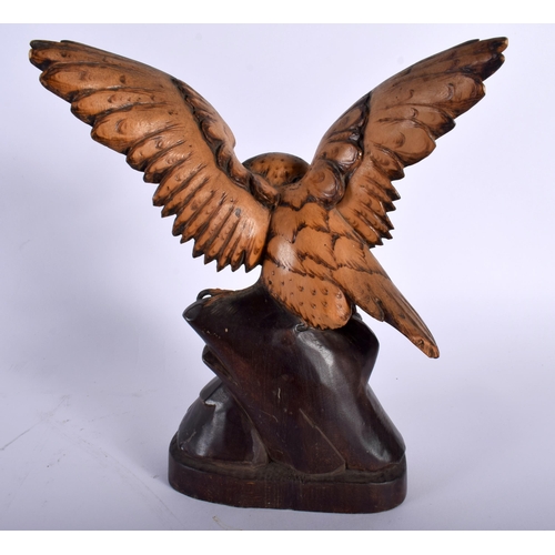 519 - AN ANTIQUE BAVARIAN BLACK FOREST CARVED WOOD HAWK. 21 cm x 13 cm.