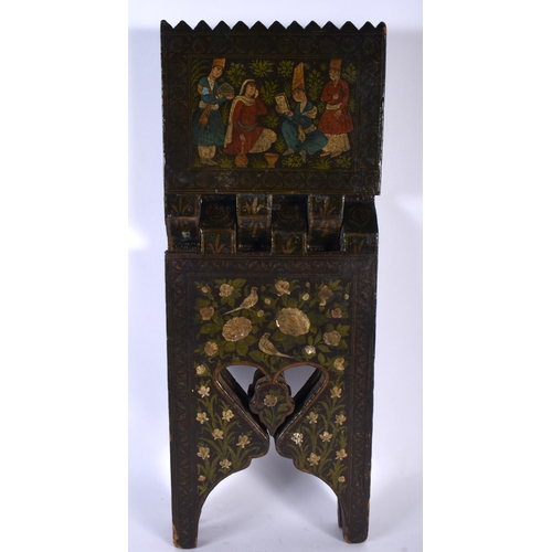 519A - A 19TH CENTURY ISLAMIC MIDDLE EASTERN QURAN LACQUER STAND painted with figures and landscapes. 40 cm... 