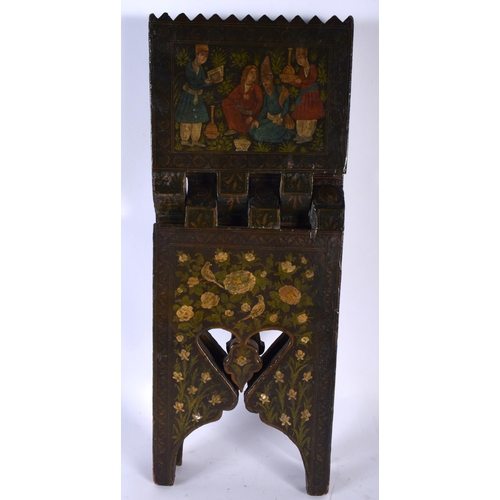 519A - A 19TH CENTURY ISLAMIC MIDDLE EASTERN QURAN LACQUER STAND painted with figures and landscapes. 40 cm... 