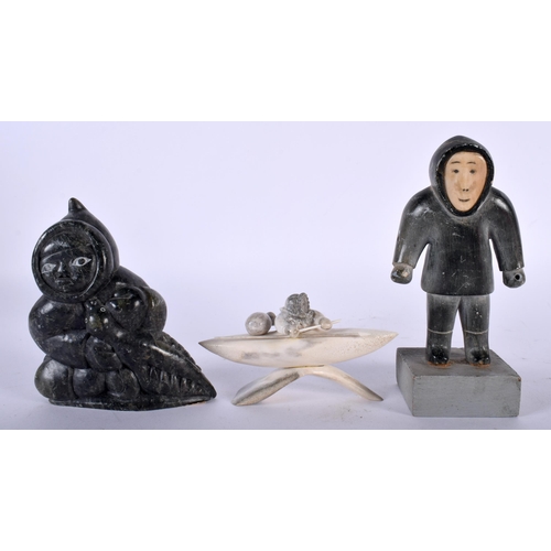 519D - A NORTH AMERICAN INUIT CARVED STONE FIGURE OF A HUNTER together with a small inuit stone male & a ca... 