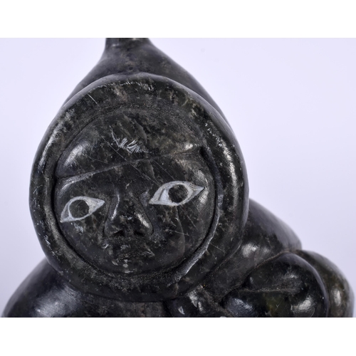 519D - A NORTH AMERICAN INUIT CARVED STONE FIGURE OF A HUNTER together with a small inuit stone male & a ca... 