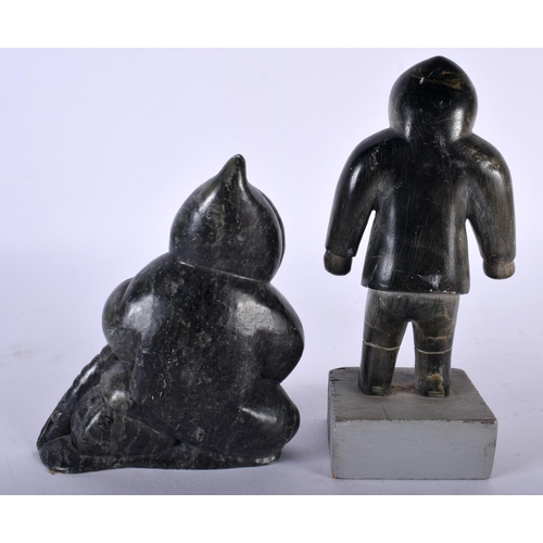 519D - A NORTH AMERICAN INUIT CARVED STONE FIGURE OF A HUNTER together with a small inuit stone male & a ca... 