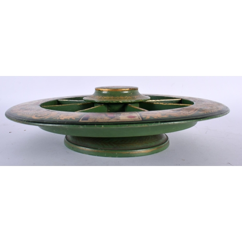 519E - AN ANTIQUE COUNTRY HOUSE GREEN LACQUER GILDING GAMING BOARD. 30 cm diameter.