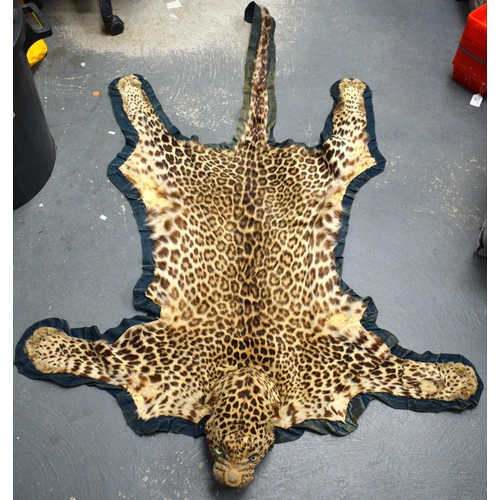 520E - A LATE VICTORIAN/EDWARDIAN TAXIDERMY CHEETAH SKIN. 168 cm x 84 cm.