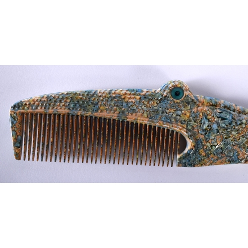 522B - A RARE 1970S FRENCH ALIGATOR COMB together with an antique agate letter opener. Largest 26 cm wide. ... 