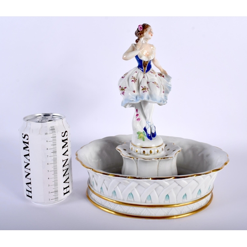 522D - A LARGE ANTIQUE GERMAN FIGURAL PORCELAIN CENTREPIECE formed as a female holding her dress. 26 cm x 1... 