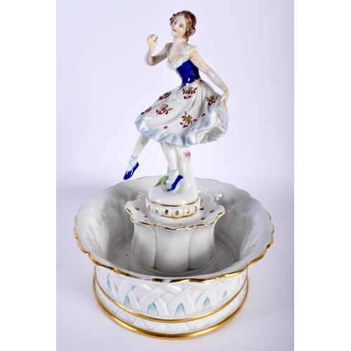 522D - A LARGE ANTIQUE GERMAN FIGURAL PORCELAIN CENTREPIECE formed as a female holding her dress. 26 cm x 1... 