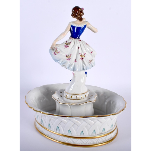 522D - A LARGE ANTIQUE GERMAN FIGURAL PORCELAIN CENTREPIECE formed as a female holding her dress. 26 cm x 1... 