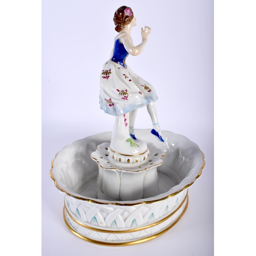 522D - A LARGE ANTIQUE GERMAN FIGURAL PORCELAIN CENTREPIECE formed as a female holding her dress. 26 cm x 1... 