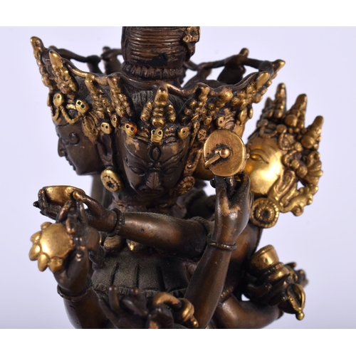 523A - A 19TH CENTURY CHINESE TIBETAN PARTIAL GILT BRONZE BUDDHA modelled as a multi armed male performing ... 