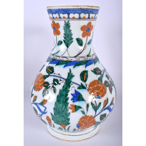 530 - A TURKISH IZNIK FAIENCE WATER JUG painted with flowers. 23 cm high.