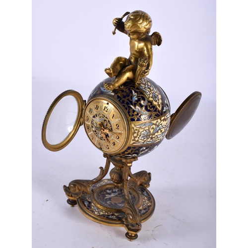 54 - A GOOD 19TH CENTURY FRENCH CHAMPLEVE ENAMEL AND BRONZE CLOCK modelled with a seated putti upon a cir... 