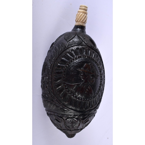 540 - A MID 19TH CENTURY FRENCH COLONIAL CARVED COCONUT BUG BEAR POWDER FLASK. 14 cm x 7 cm.