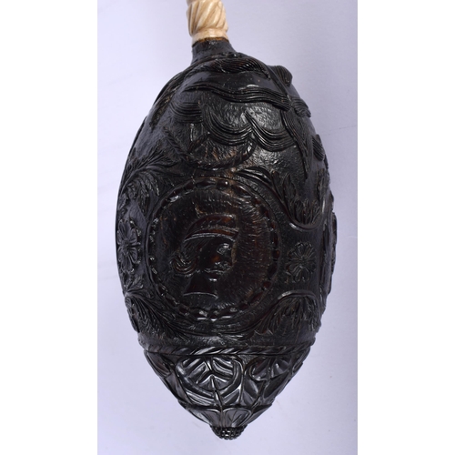 540 - A MID 19TH CENTURY FRENCH COLONIAL CARVED COCONUT BUG BEAR POWDER FLASK. 14 cm x 7 cm.