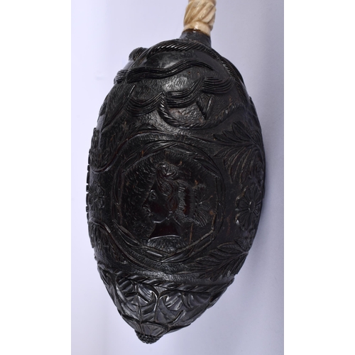 540 - A MID 19TH CENTURY FRENCH COLONIAL CARVED COCONUT BUG BEAR POWDER FLASK. 14 cm x 7 cm.