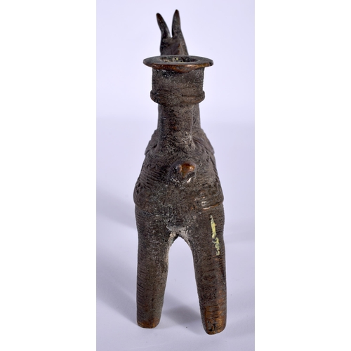 543 - AN ANTIQUE MIDDLE EASTERN ZOOMORPHIC BRONZE CANDLESTICK formed as a horse. 11 cm x 8 cm.