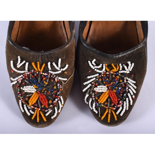 549 - A PAIR OF TURKISH BEADWORK SHOES. 24 cm long.