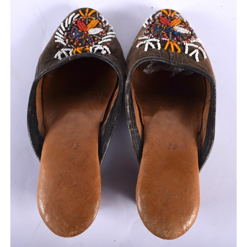 549 - A PAIR OF TURKISH BEADWORK SHOES. 24 cm long.