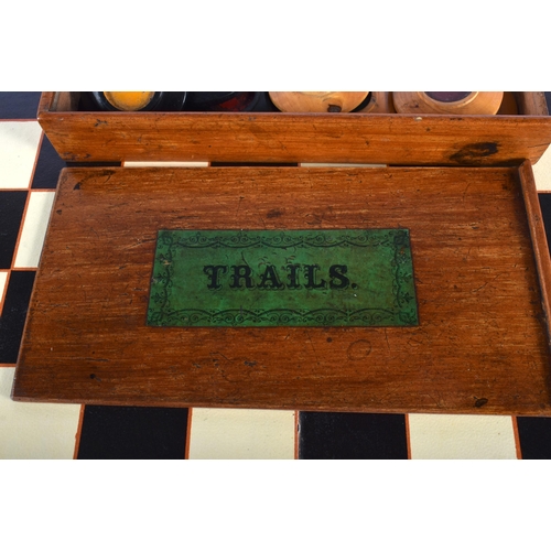 551 - A VICTORIAN TRAILS GAME with board. Box 22 cm x 13 cm.