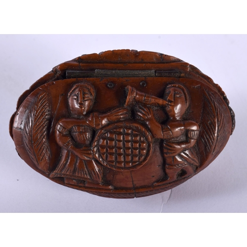 554 - AN 18TH/19TH CENTURY FRENCH CARVED COQUILLA NUT SNUFF BOX. 7 cm x 4.5 cm.