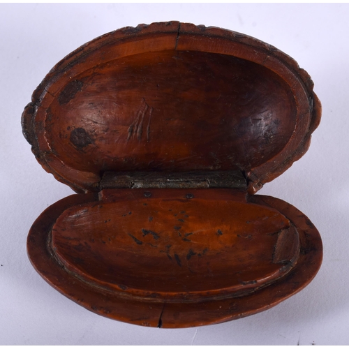 554 - AN 18TH/19TH CENTURY FRENCH CARVED COQUILLA NUT SNUFF BOX. 7 cm x 4.5 cm.