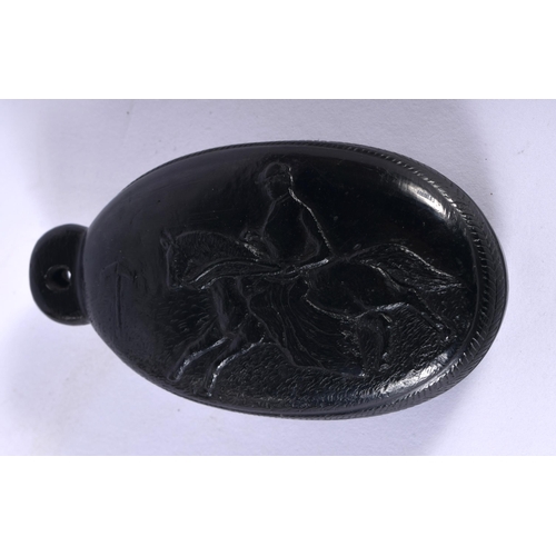 555 - A RARE VICTORIAN IRISH CARVED BOX OAK EQUESTRIAN HAND MIRROR. 8.5 cm x 5.5 cm.