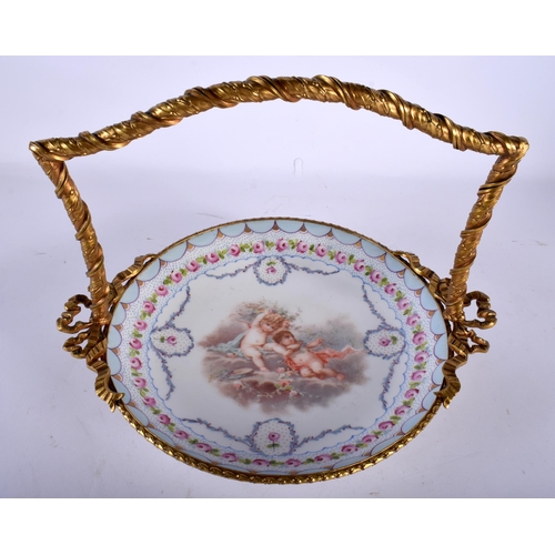56 - A 19TH CENTURY FRENCH SEVRES PORCELAIN BASKET mounted in French bronze, formed with ribbons. 23 cm x... 
