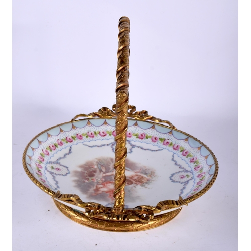 56 - A 19TH CENTURY FRENCH SEVRES PORCELAIN BASKET mounted in French bronze, formed with ribbons. 23 cm x... 