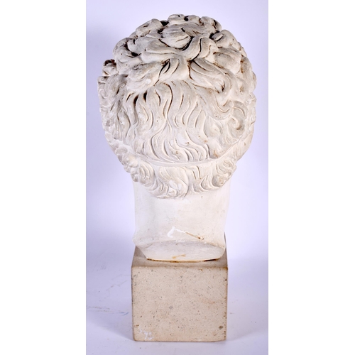 562 - A PLASTER BUST OF A ROMAN YOUTH After the Antiquity. 30 cm high.