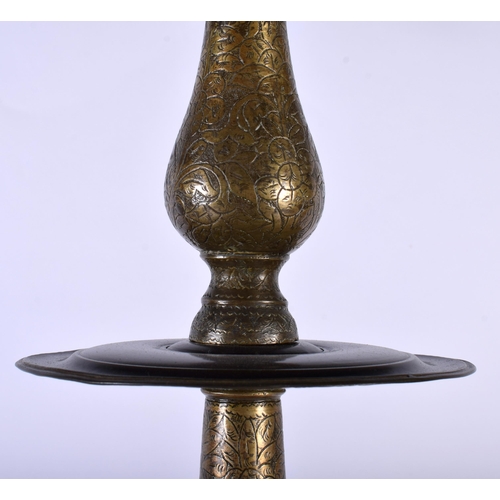 564 - A VERY LARGE 18TH CENTURY ISLAMIC MIDDLE EASTERN BRONZE PRICKET CANDLESTICK decorative all over with... 