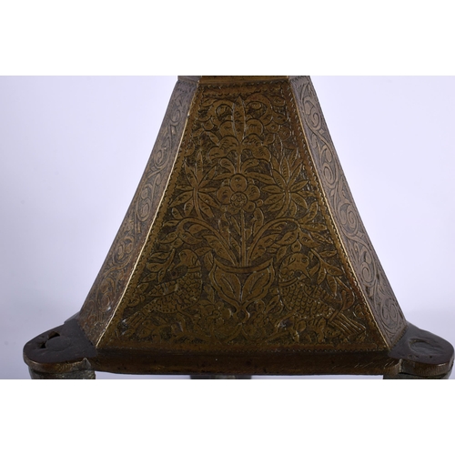 564 - A VERY LARGE 18TH CENTURY ISLAMIC MIDDLE EASTERN BRONZE PRICKET CANDLESTICK decorative all over with... 