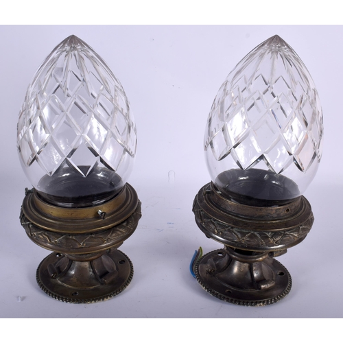 565 - A GOOD PAIR OF ANTIQUE BRONZE CUT GLASS HANGING LANTERNS. 25 cm long.