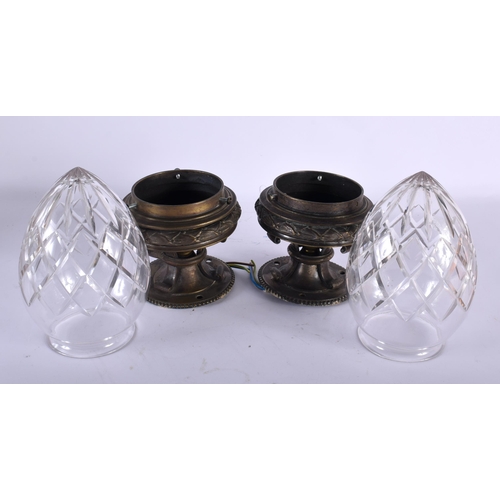 565 - A GOOD PAIR OF ANTIQUE BRONZE CUT GLASS HANGING LANTERNS. 25 cm long.