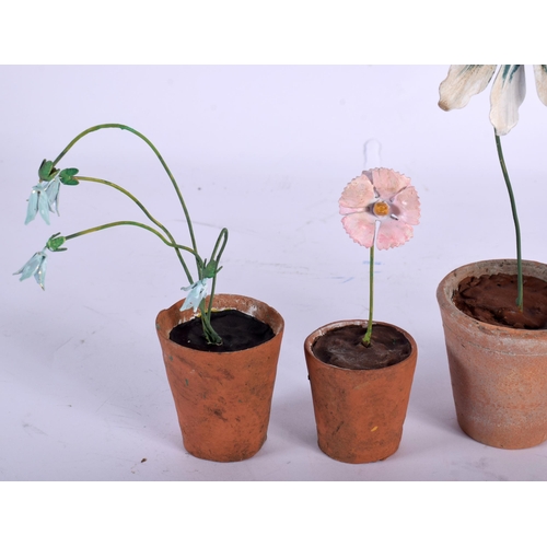 570 - A SET OF FIVE VINTAGE FRENCH TERRACOTTA AND ENAMEL FLOWER POTS. Largest 21 cm high. (5)