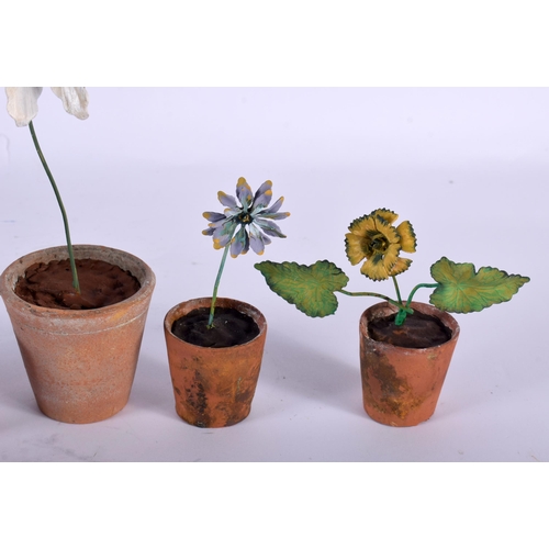 570 - A SET OF FIVE VINTAGE FRENCH TERRACOTTA AND ENAMEL FLOWER POTS. Largest 21 cm high. (5)