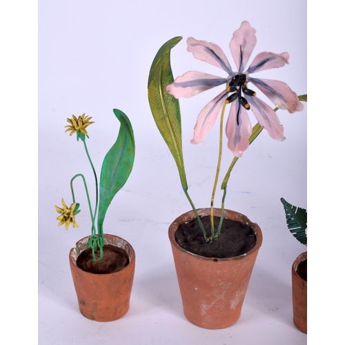 571 - A SET OF FIVE VINTAGE FRENCH TERRACOTTA AND ENAMEL FLOWER POTS. Largest 15 cm high. (5)