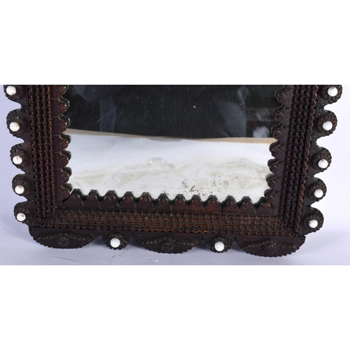 572 - AN ANTIQUE TRAMP ART MIRROR. 52 cm x 34 cm.